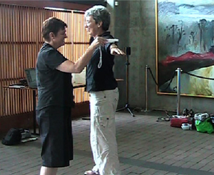 Two people interacting in a workshop